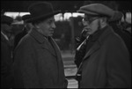 Group of men at a railroad station, with Karl Berngardovich Radek, a writer and Marxist revolutionary in the USSR, ca. 1932-1933 by Jacobi, Lotte, 1896-1990