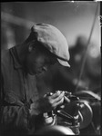 Worker looking at equipment in the USSR, ca. 1932-1933 by Jacobi, Lotte, 1896-1990