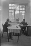 Two men at desks in the USSR, ca. 1932-1933 by Jacobi, Lotte, 1896-1990