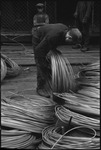 Worker with a bundle of wire in the USSR, ca. 1932-1933 by Jacobi, Lotte, 1896-1990