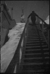 Russian person walking up steps in USSR, ca. 1932-1933 by Jacobi, Lotte, 1896-1990