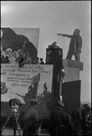 Man speaking from a tall podium at a November holiday gathering in Stalinabad (Dushanbe), Tajikistan, Central Asia, ca. 1932-1933 by Jacobi, Lotte, 1896-1990