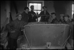 Group of young men around a car in a garage in the USSR or Central Asia, ca. 1932-1933 by Jacobi, Lotte, 1896-1990