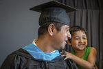 Bhutanese Man and Son at Graduation, 2014 by Becky Field