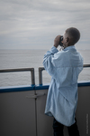Young Immigrant on a Whale-watching Trip, 2016 by Becky Field