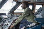 Congolese Man on a Whale-watching Trip, 2016 by Becky Field