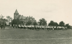 Freshman Week, men's gymnastics in front of Thompson Hall, ca. Fall 1924 by Clement Moran