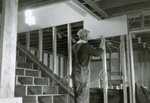 Practice House Construction, Fall 1930: Attaching wall board by Clement Moran