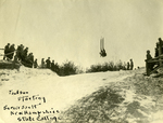 Carl Paulson completing a somersault on ski jump, ca. 1910s by Clement Moran