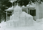 Winter Carnival, February 2, 1935: Delta Epsilon Pi House and snow sculpture by Clement Moran