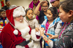 Santa with Immigrant Children, 2012 by Becky Field