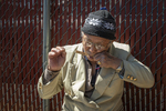 Bhutanese Man Playing Binayo, 2014 by Becky Field