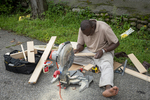 Somali Carpenter in His Driveway, 2012 by Becky Field