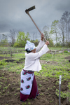 Burundi Woman with Hoe in the Community Gardens, 2012 by Becky Field